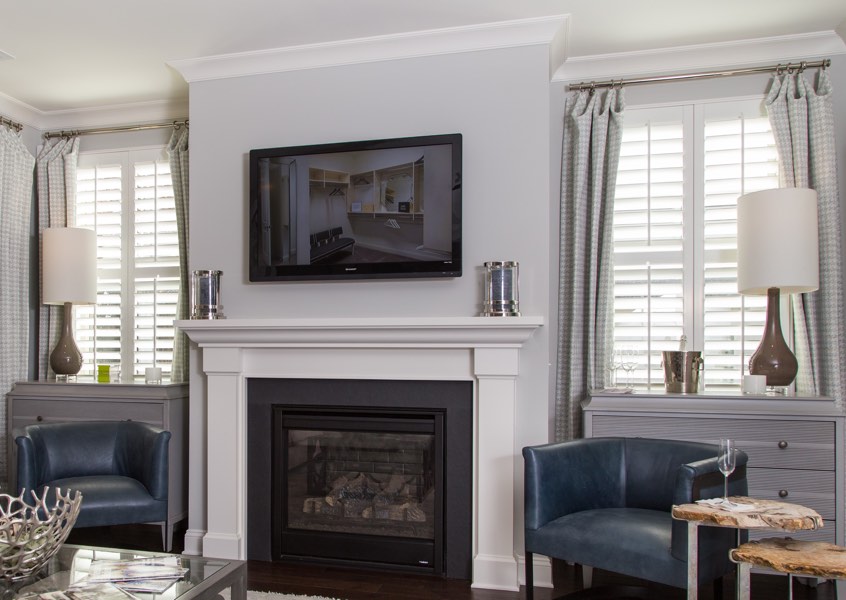 tv room Minneapolis faux wood shutters